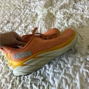 Hoka Orange and Yellow Running Shoes